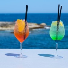 Two refreshing cocktails with an amazing seaview