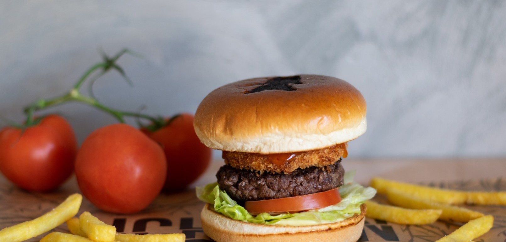 Beef burger with camembert cheese and fries