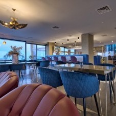 Touches of mixed metals in brass and copper complete the elegant setting