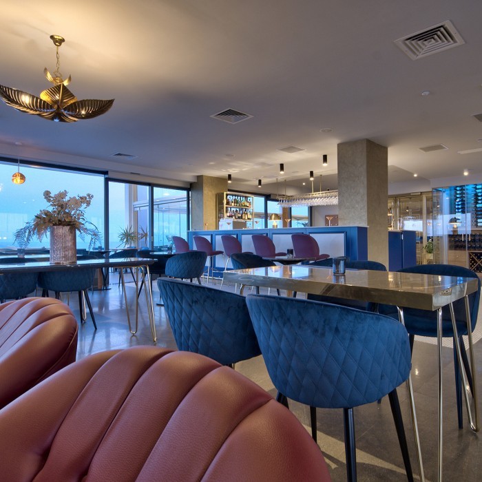 Touches of mixed metals in brass and copper complete the elegant setting