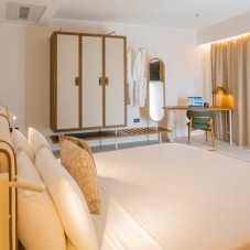 Double bedroom with private sea view balcony in the Sea View Suite
