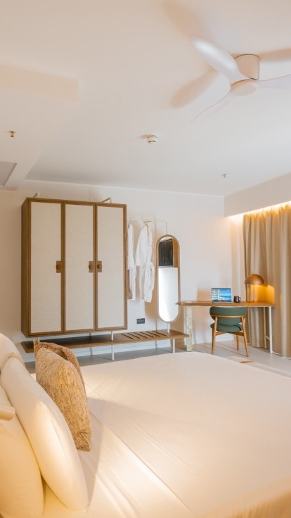 Double bedroom with private sea view balcony in the Sea View Suite