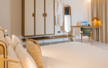 Double bedroom with private sea view balcony in the Sea View Suite